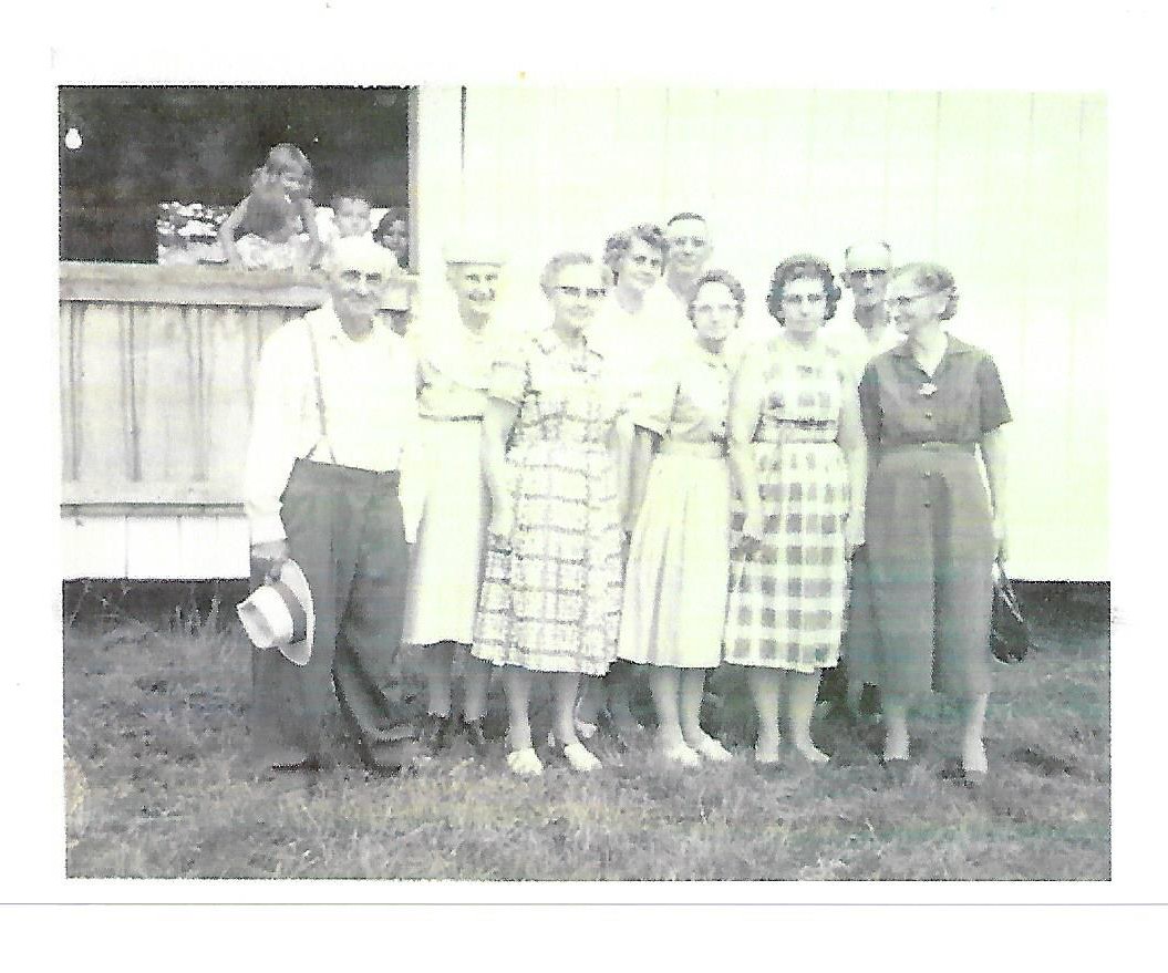 Archival scan crop showing maddox family reunion at Barlow Fairgrounds in July 1961. Front row: George William, Bertha Smith, Pearl, Martha, Marie, and Flora Mae Maddox; back row: Vesta Maddox Enoch Pickens, Holly Maddox, and Harry Maddox.